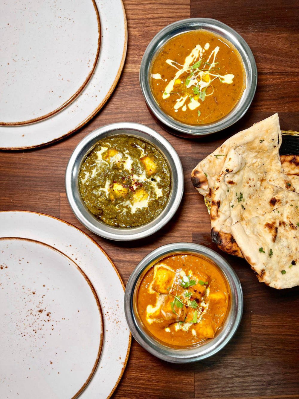 Palak paneer, butter paneer and dal makhani with fresh naan